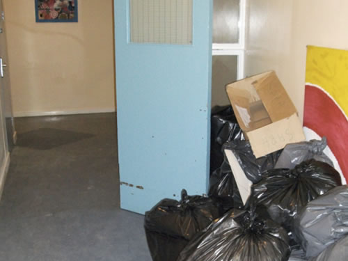 Combustible items increase risk in rubbish escape route 